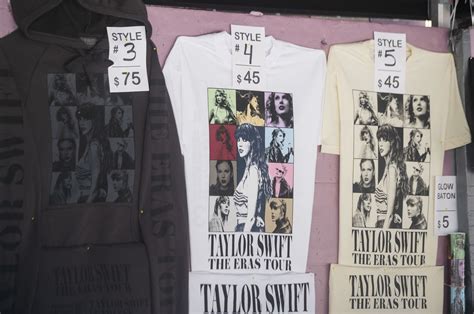 Taylor Swift fan Annabella Siegel, 12, of Orlando, is happy with her haul at the tour merchandise truck on Wednesday, April 12, 2023, at Raymond James Stadium.